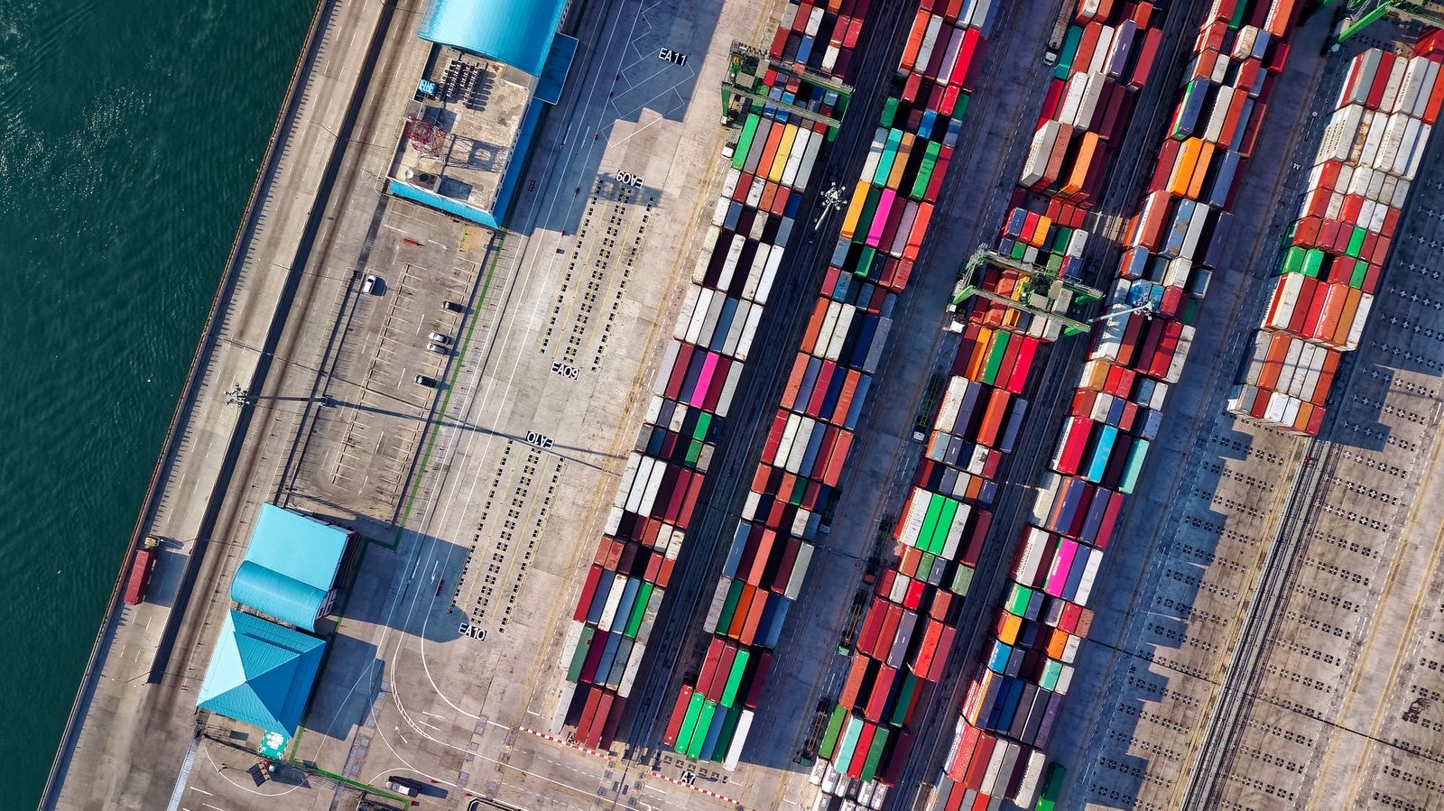 Aerial view of a container yard with stacked boxes