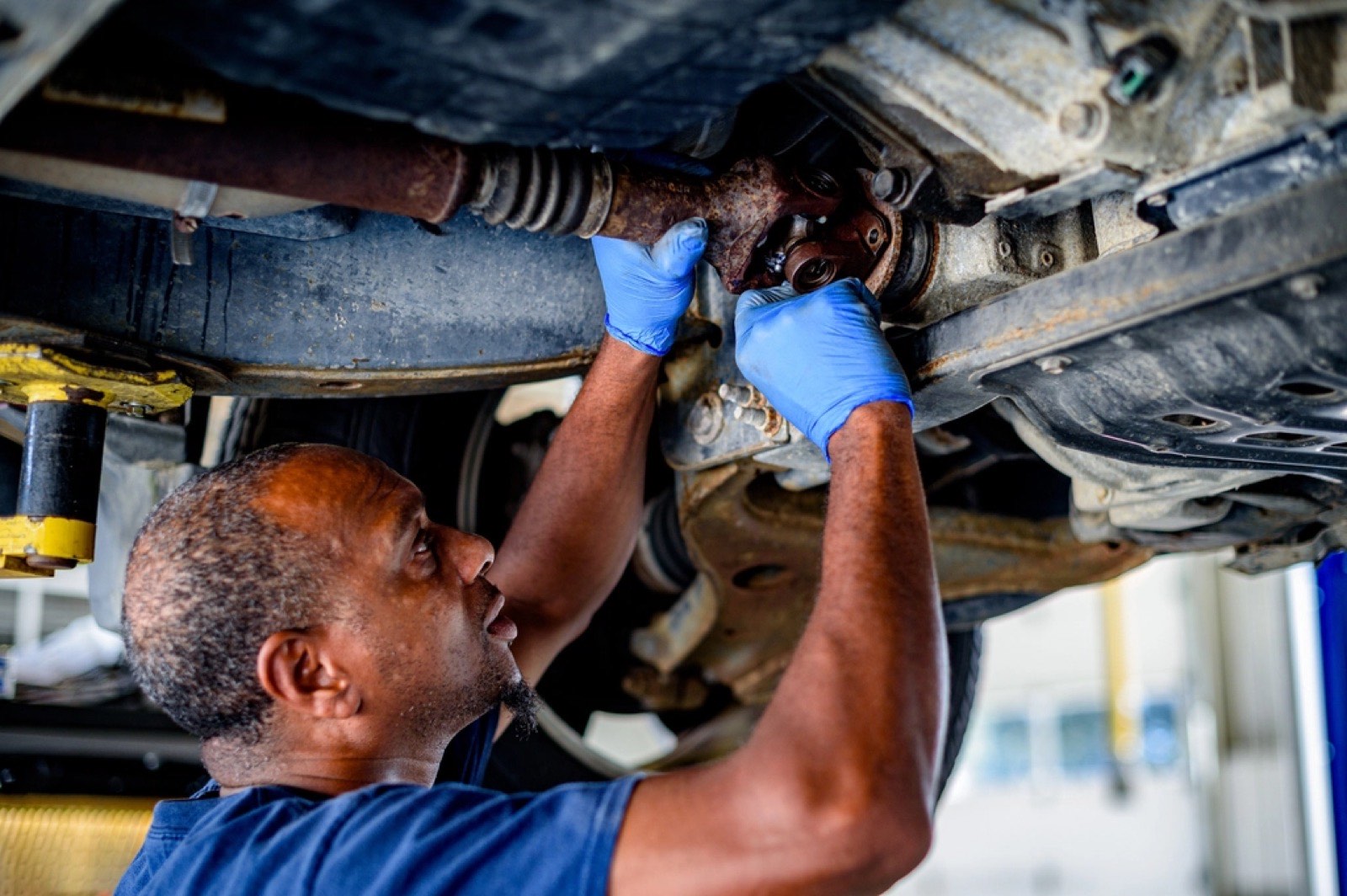 Mechanic working under a commercial truck